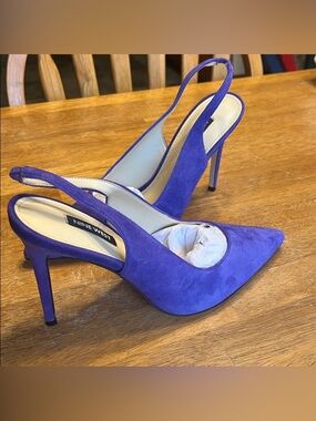 Nine West, medium purple, sling back 4 inch heels! Worn once. Size 8 1/2. In box